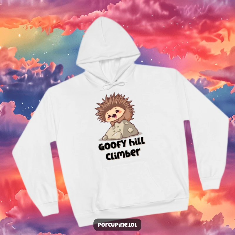 Funny hoodie depicting a goofy kawaii porcupine with a smile, climbing a small hill, offering cozy and humorous motivation.