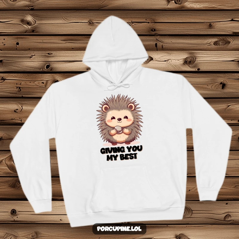 Funny hoodie featuring a shy porcupine with a gentle smile, holding out a small, shiny pebble to share.