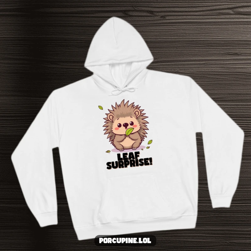 Funny hoodie depicting a kawaii porcupine with a surprised expression as a leaf falls, offering cozy and humorous comfort.