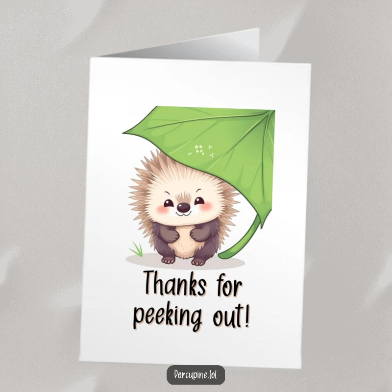 Funny Free Printable Thank You Card: A porcupine with a bashful smile peeks from behind a leafy cover, conveying thanks with charm.