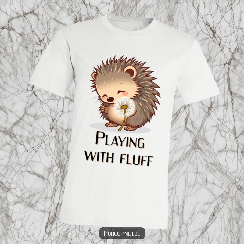 Funny porcupine t-shirt showing a porcupine playfully poking a rolling dandelion puff, highlighting whimsical interaction.