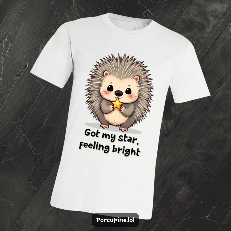 Funny Porcupine T-Shirt: A porcupine balancing a tiny, shimmering star on its nose, showcasing humorous determination and aspiration.