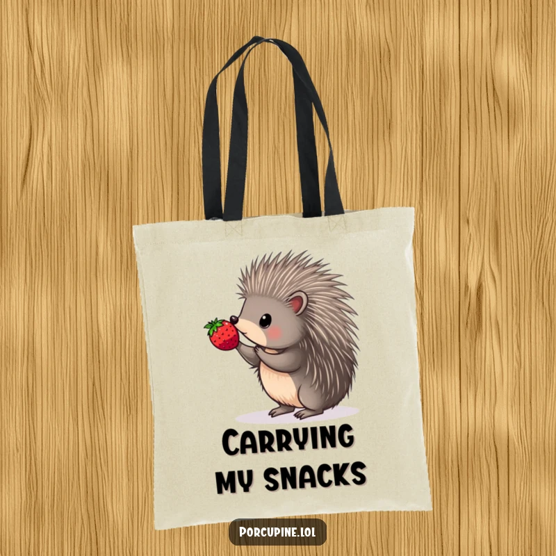 Funny tote bag featuring a porcupine artfully balancing a berry on the very tip of one sharp quill.