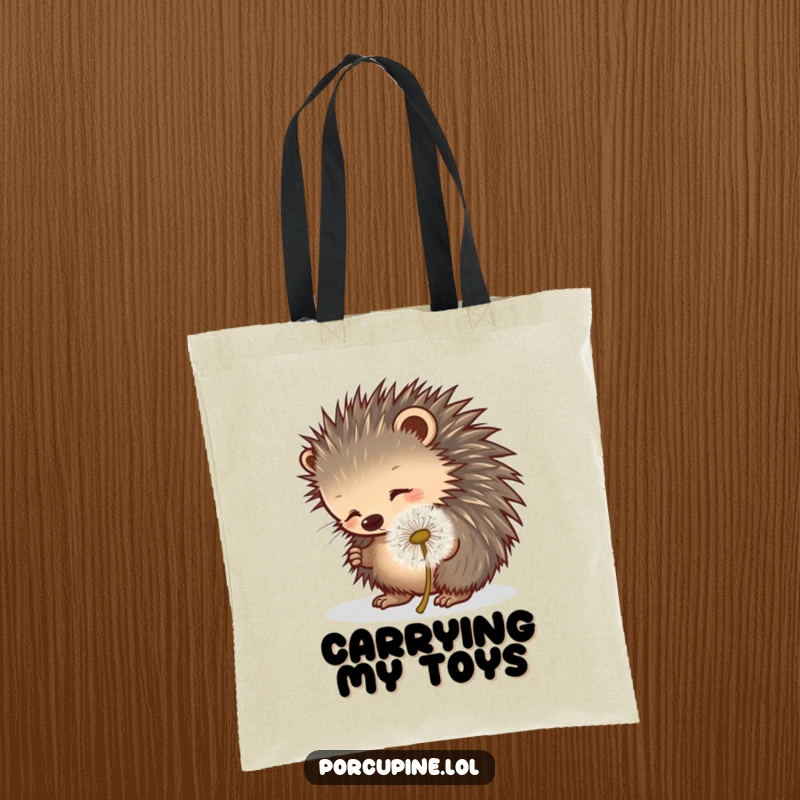 Funny porcupine tote bag showing a porcupine playfully poking a rolling dandelion puff, embodying lighthearted fun.