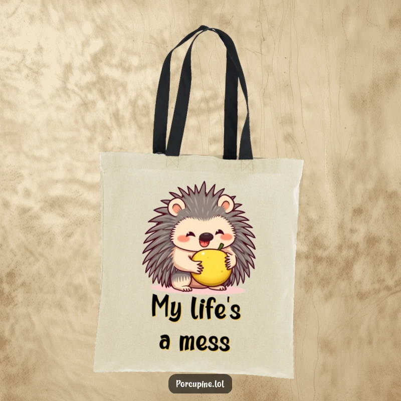 Funny tote bag depicting a gleeful porcupine attempting to balance a tiny piece of fruit on its spiky back, showcasing playful effort.